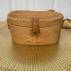 Woven straw small purse with shoulder strap snap front, burgundy/white striped.